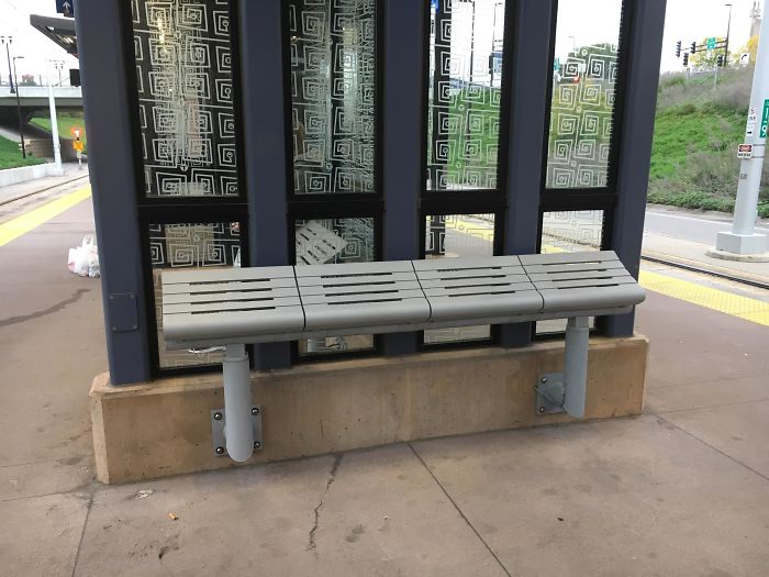 Metro Stop Bench Is Tilted So Attempting To Lay Down Ends Up With You Sliding Off
