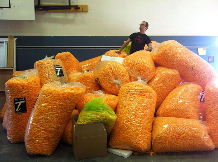 My Friend Purchased 28 Industrial Sized Clear Bags Of Cheetos. Each Bag Cost Him $65. What Was The Amount He Paid In Total?