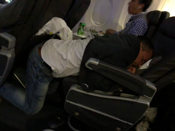 Man Sleeping On Plane