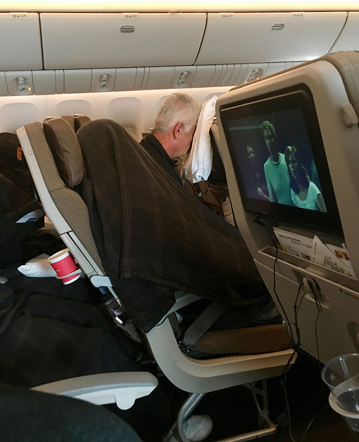 Sleeping Positions In Economy Class On An 11-Hour Flight
