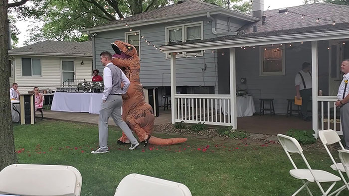Maid Of Honor Crashes Her Sister's Wedding Dressed Up As A T-Rex