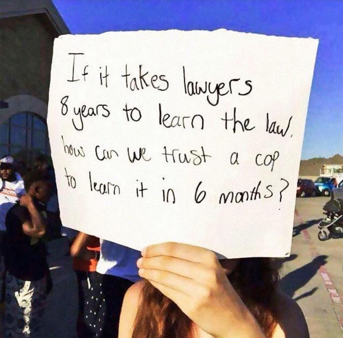Person Puts Up A Sign About Police Officers’ Legal Knowledge And It Starts A Heated Discussion