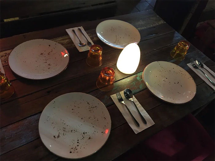 The Design Of These Plates At A Restaurant Makes It Look Like They Are Dirty