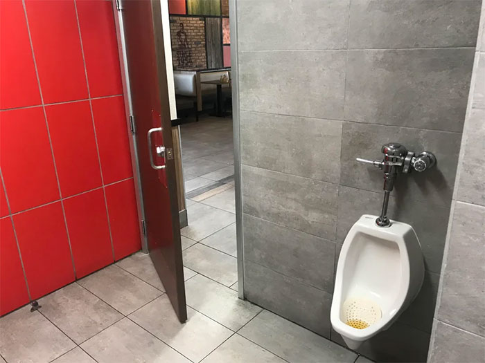 Lets Just Put The Urinal Next To Where The Door Opens So Everyone In The Restaurant Can Watch Me Take A Piss