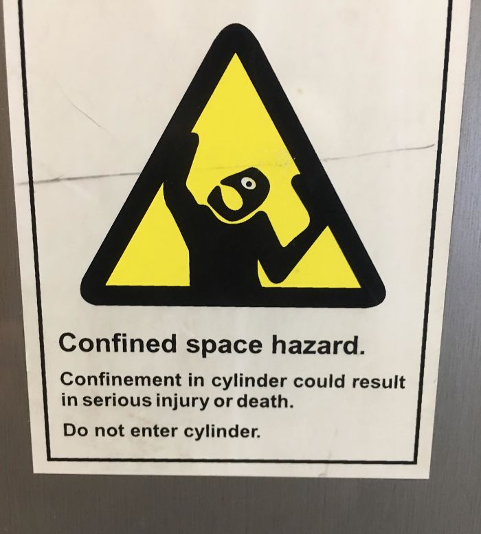 I’ve Never Seen A Look Of Terror On A Little Sign Guy. Sign On A Commercial Washing Machine