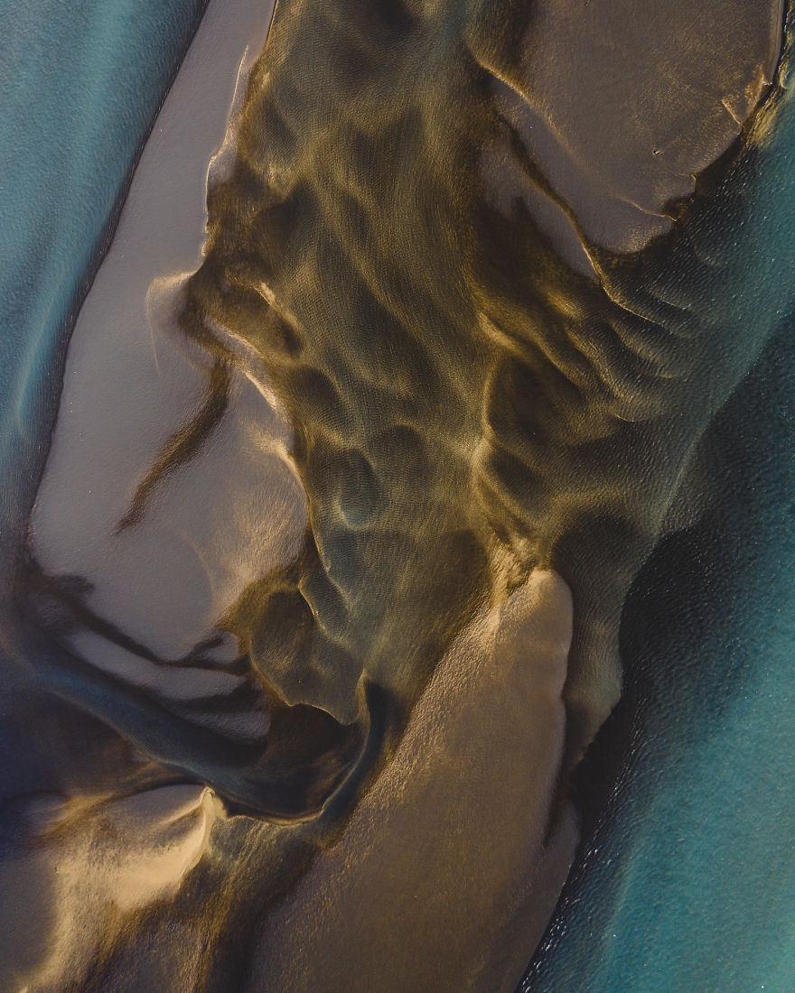 Drone Photo Of Sulfur River Merging With Fresh Water Coming Down From A Melting Glacier