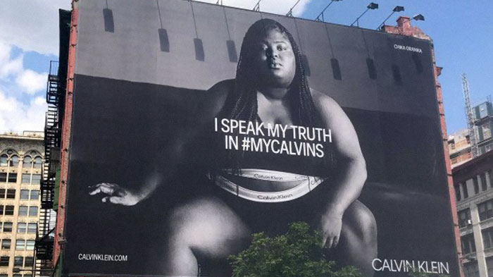 Woman Shames Calvin Klein’s Plus-Size Rapper Billboard, She Responds And Starts A Heated Discussion