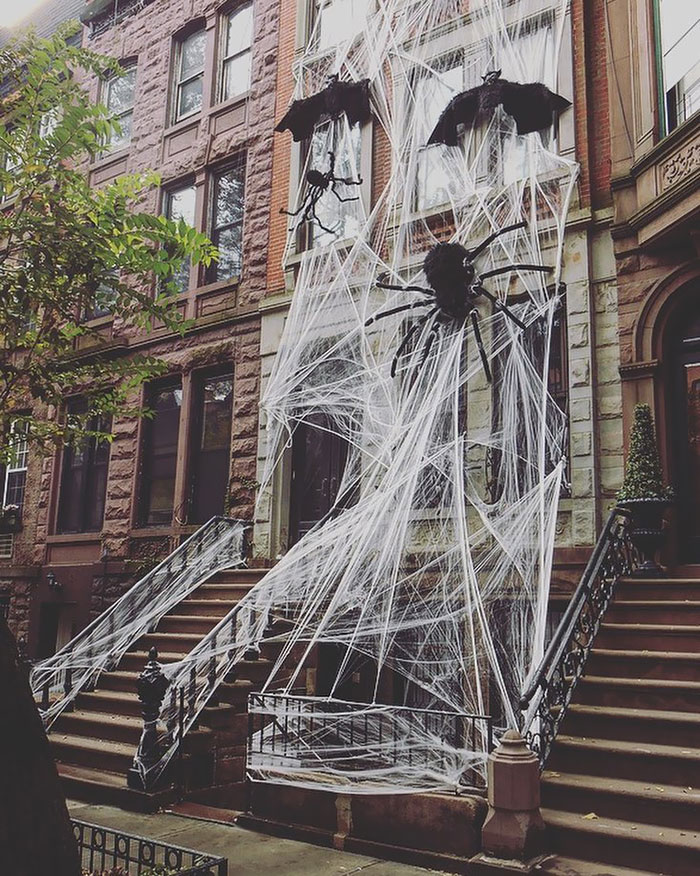 You Know It's Halloween In New York When People Cover Their Apartments In Giant Spiderwebs