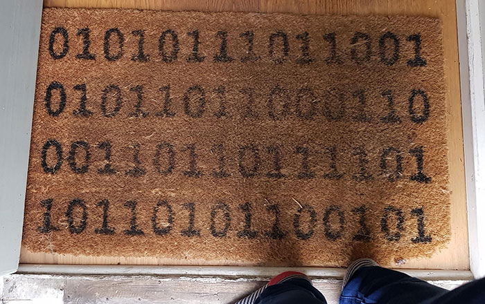 This Doormat Which Says "Welcome" In Binary