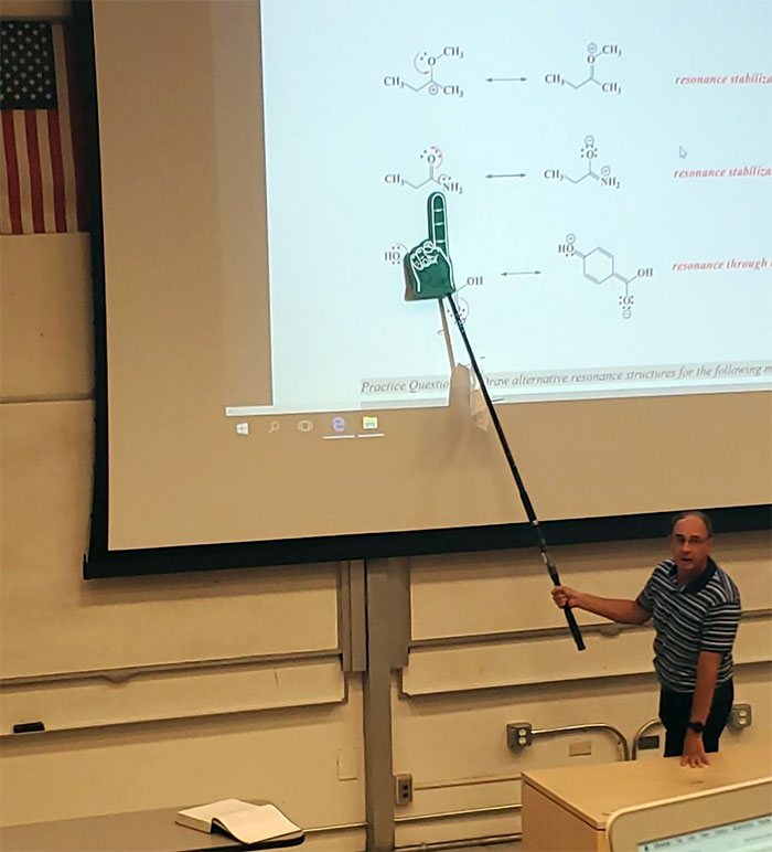 My Professor Doesn't Believe In Laser Pointers So He Uses A Fishing Pole With A Foam Finger Attached And I Can't Contain Myself During A Lecture