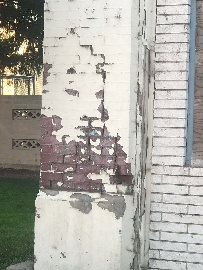 The Paint Peeling On This Building Kind Of Looks Like The Head Of A Lion