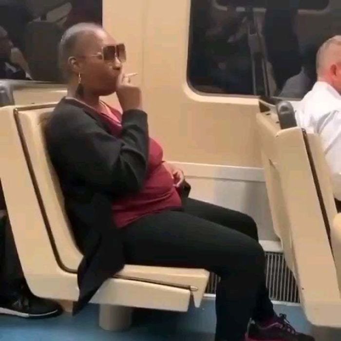 Lady Refuses To Throw Her Cigarette Away Even Though She's Delaying The Train For Everyone Else