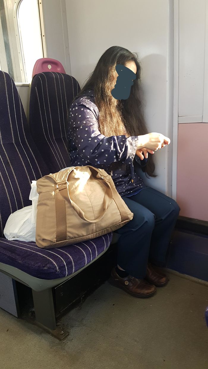 This Woman Cutting Her Nails And Letting Them Fall In The Train