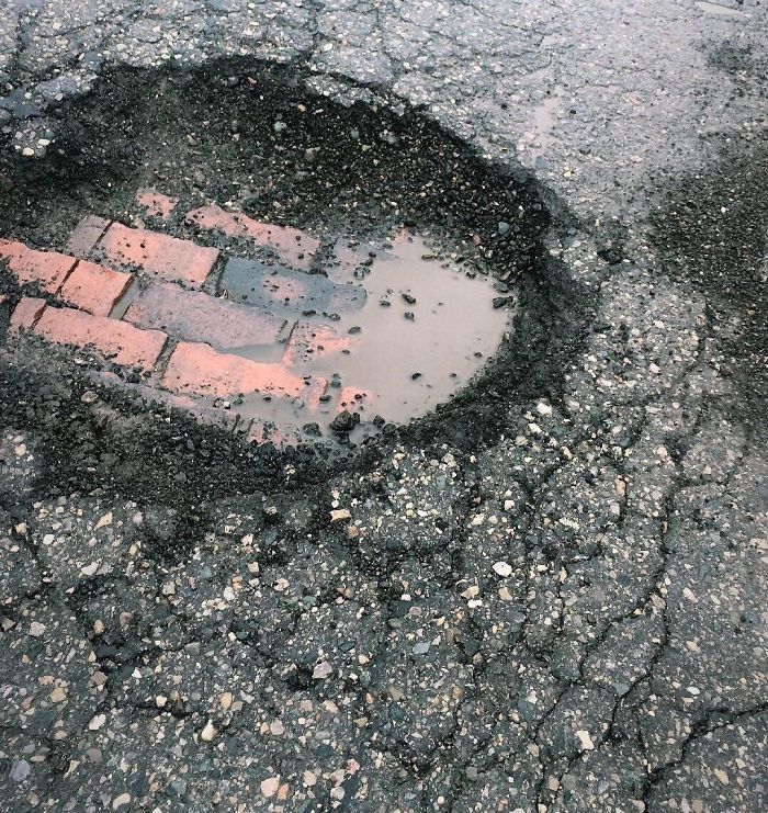 This Pothole Has Started To Reveal The Original Brick Road Underneath