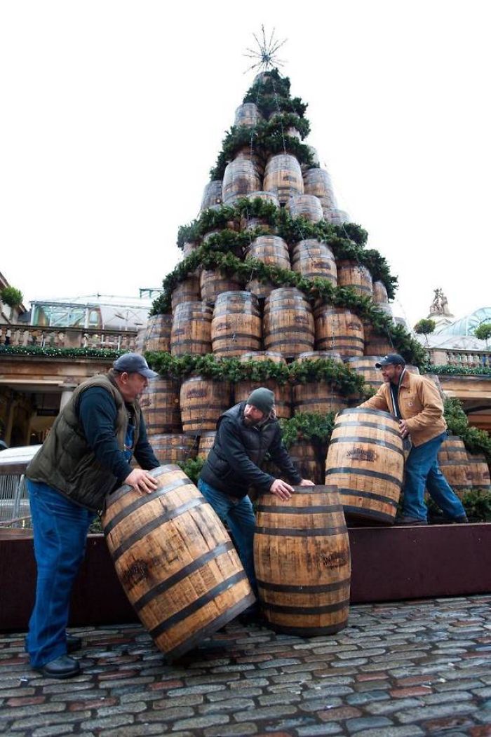 Employees From The Jack Daniel’s Distillery In Lynchburg, Tennessee, Complete A 26 Ft High Christmas Barrel Tree In London