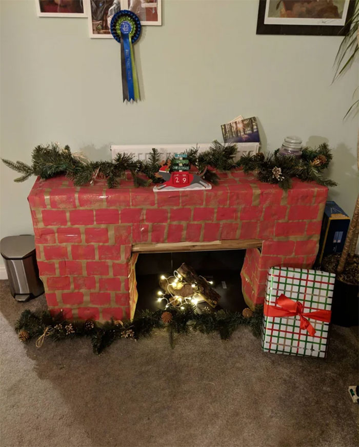 My Wife Made A Christmas Fireplace Out Of Wine Boxes And Brown Paper