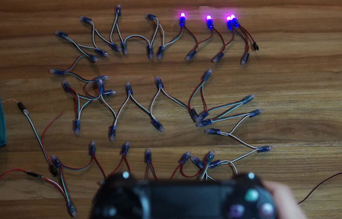Engineer Shares A Video Of Christmas Tree Lights Turned Into A Snake Game Controlled With PS4 Controller