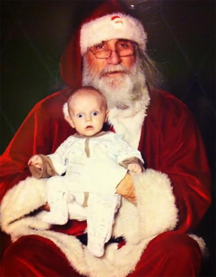 My 3 Month Old Son With A Look Of Shock Only He Could Pull Off At Being Sat On Santa’s Lap