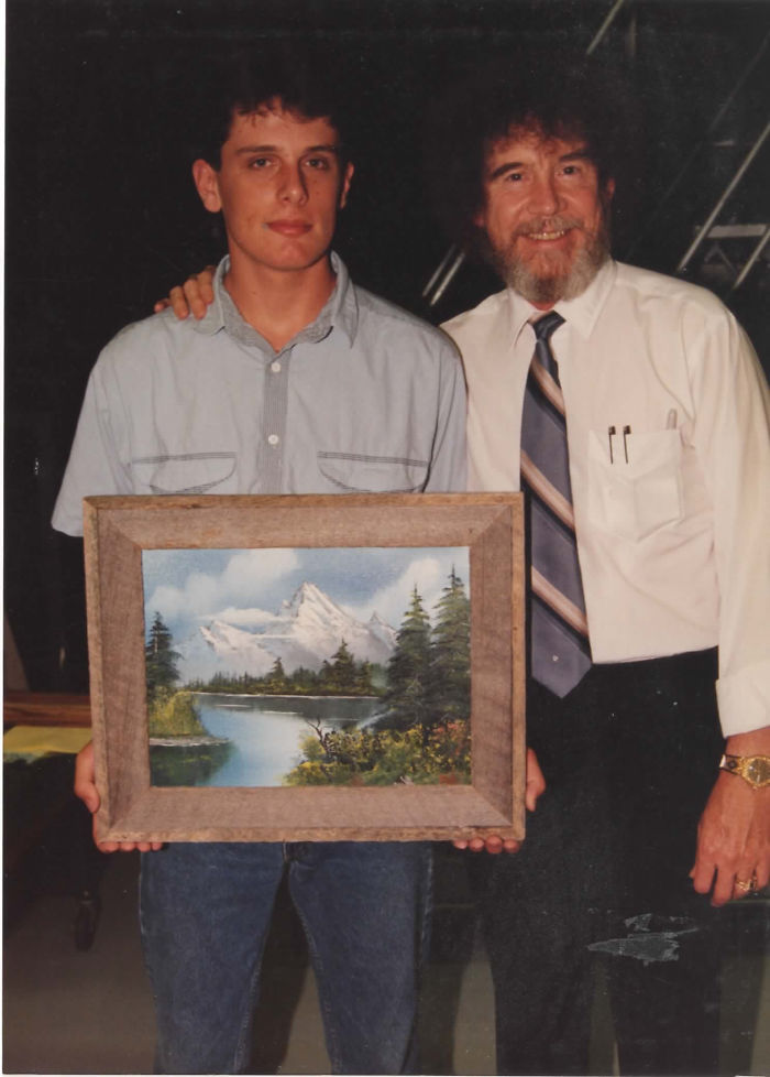 1990: A Fan Gets A Photo With Bob Ross And A Landscape He Painted Using Ross' Series