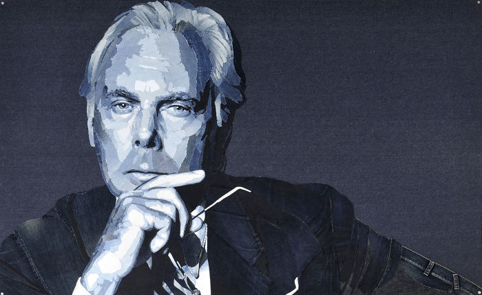 Realistic celebrity portrait crafted from denim fabric by Ian Berry, featuring detailed shades of blue and white tones.