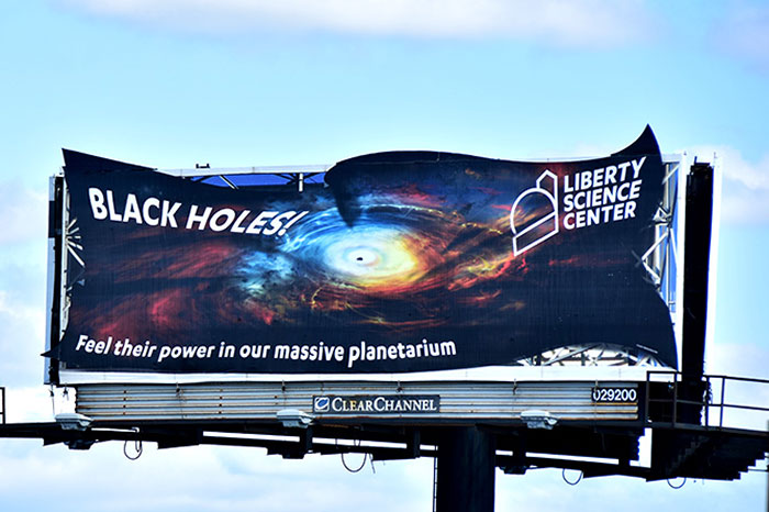 Saw This Sign Advertising A Black Hole Planetarium At The Liberty Science Centre. Definitely The Best Billboard I’ve Ever Seen