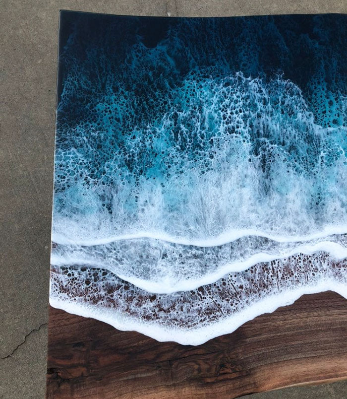 These Artists Create Mesmerizing Tables That Look Like They're Being Washed By An Ocean Wave