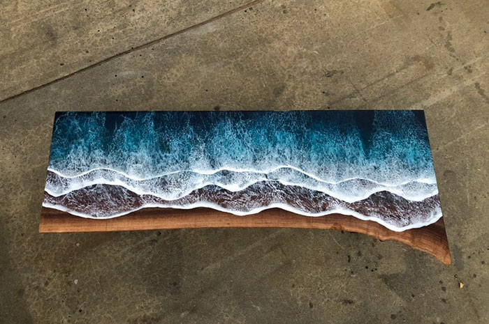 These Artists Create Mesmerizing Tables That Look Like They're Being Washed By An Ocean Wave