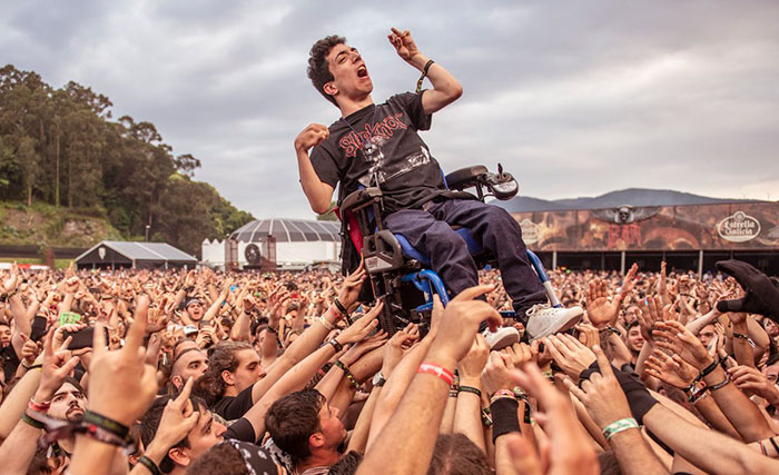 This Fan In Wheelchair Carried In A Rock Festival
