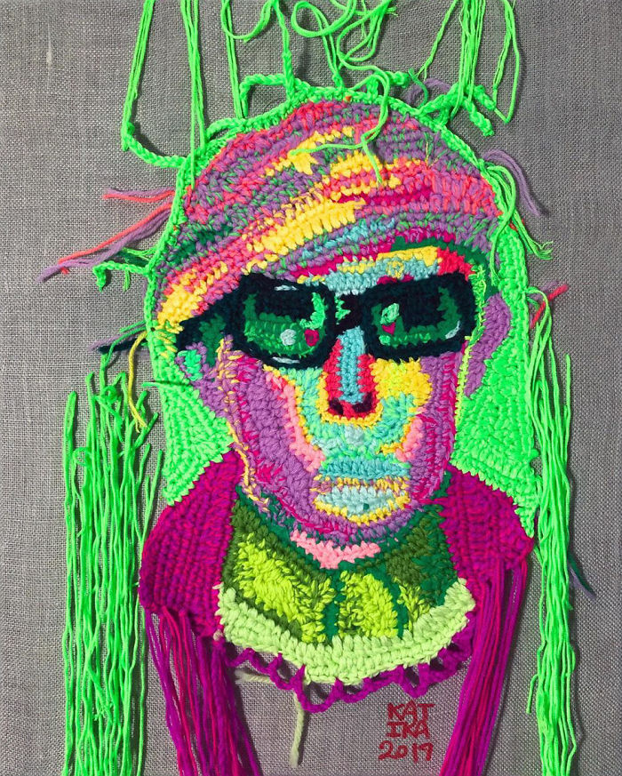 Crochet portrait of a person with sunglasses in vibrant neon colors showcasing crochet artist craftsmanship.