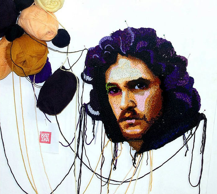 Crochet artist portrait showing a detailed crocheted face with yarn balls and threads on a white background.
