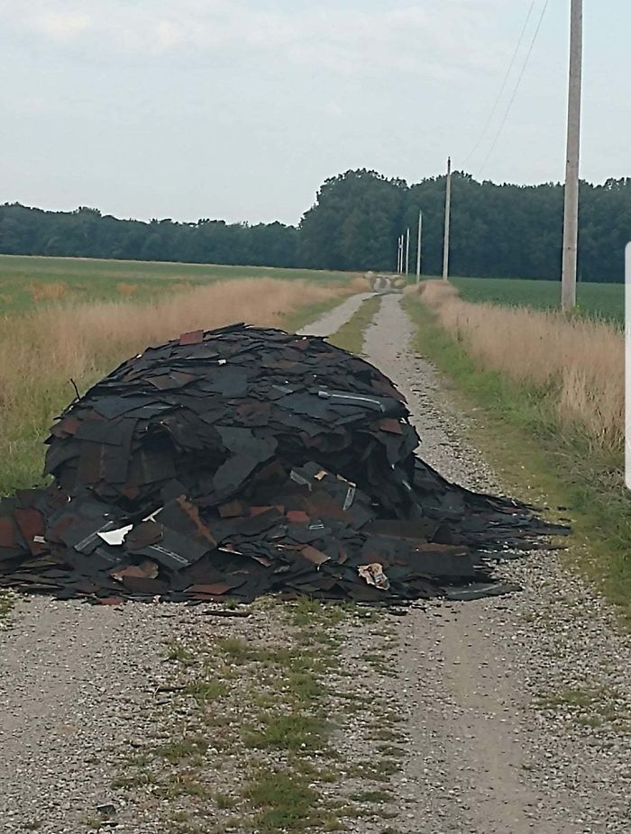 I Guess This County Road Is As Good A Place As Any To Dump The Leftover Scrap From A Roofing Job