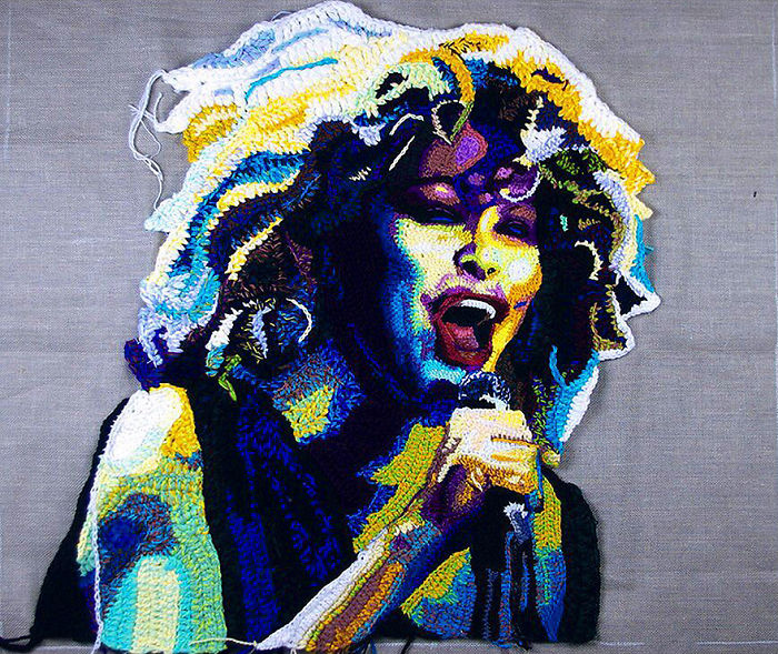 Crochet portrait of a person singing passionately, showcasing detailed and colorful yarn art by a crochet artist.