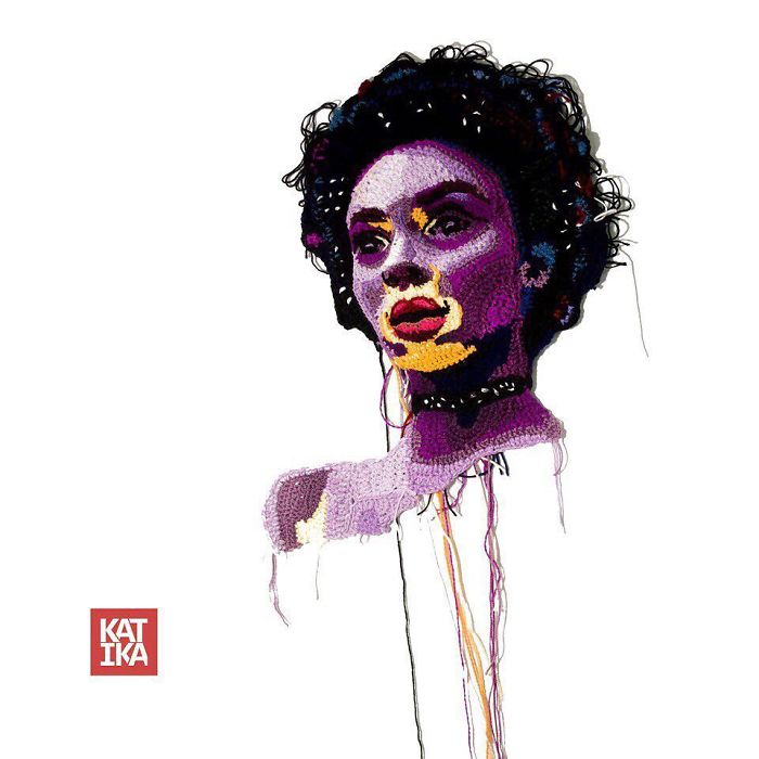 Crochet portrait of a woman with curly hair and colorful details showcasing intricate crochet art skills.