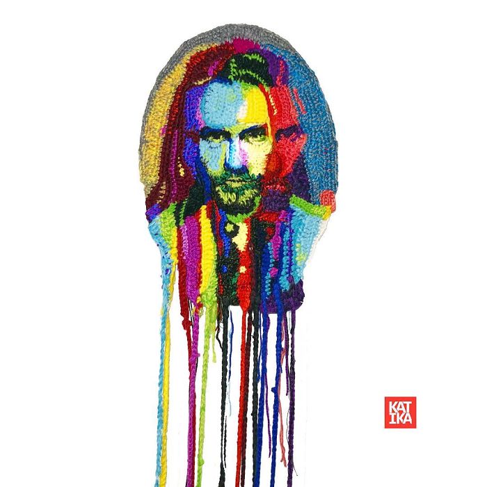 Colorful crochet portrait with dripping yarn strands showcasing unique crochet artist craftsmanship and vibrant textile art.