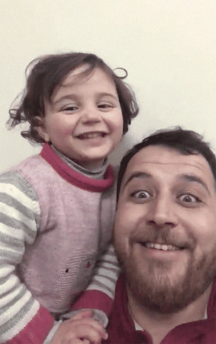 Syrian Dad Tells Daughter To Laugh When Bombs Explode In A Heartbreaking Video