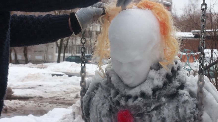 This Artist Decided To Creep People Out By Creating A 'Pennyswise' Snowman On A Swingset