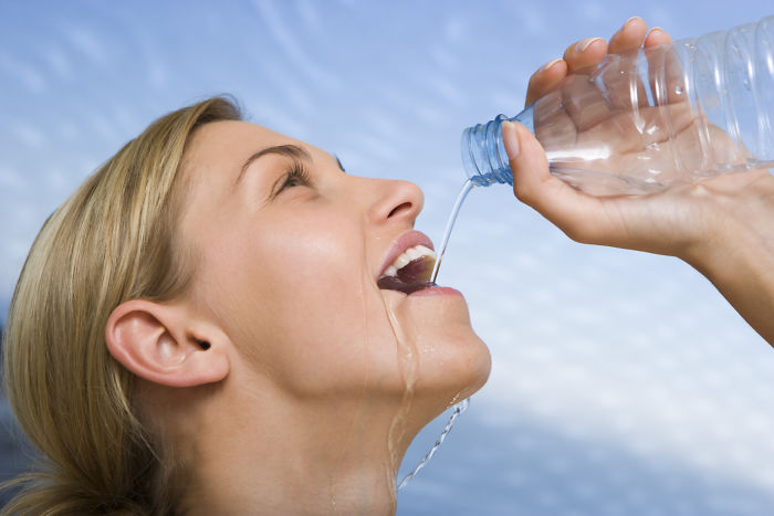 Women-Dont-Know-How-To-Drink-Water-Stock-Photos