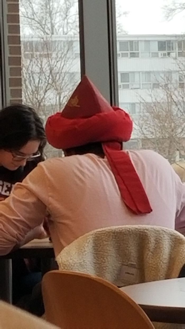 What Is This Red Hat That I See This Student Wearing All The Time?