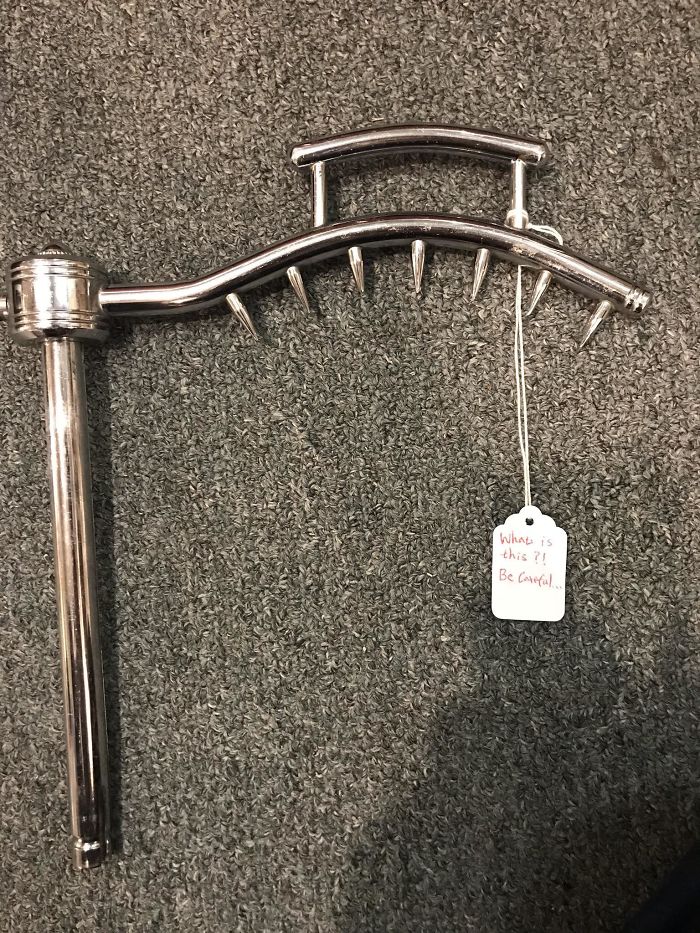 Metal Spiked Thing At An Antique Store. It Is A Roast Or Ham Holder That Mounts To A Cutting Board. The Cutting Board Is Missing