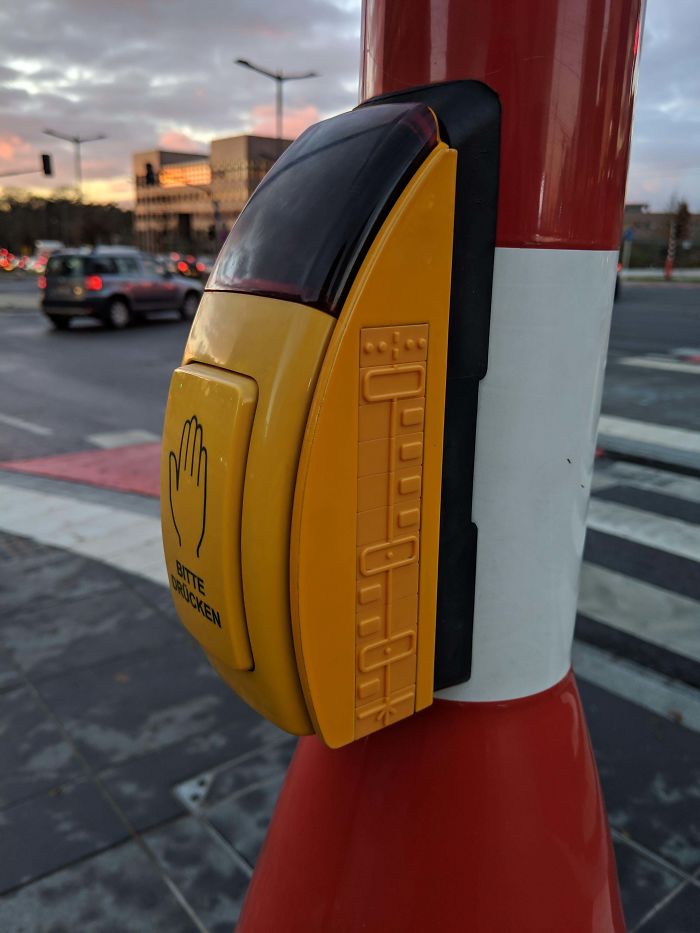 This Crosswalk Signal Button Has Signage For Blind People Showing Exactly How Many Lanes They Have To Cross And Direction Of Traffic