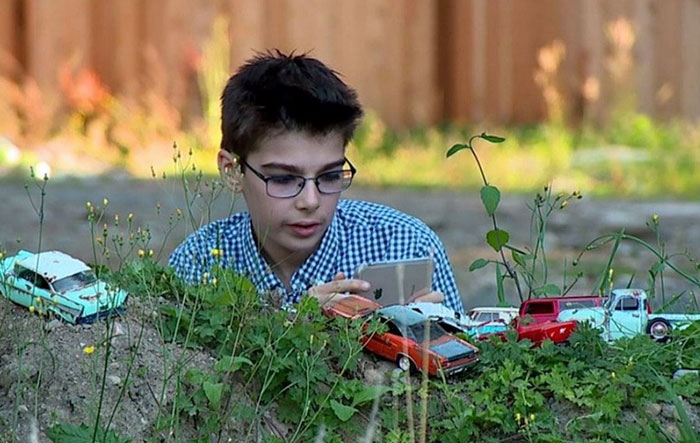 12 Y.O. Autistic Boy Raises $43k To Publish His Miniature Car Photos