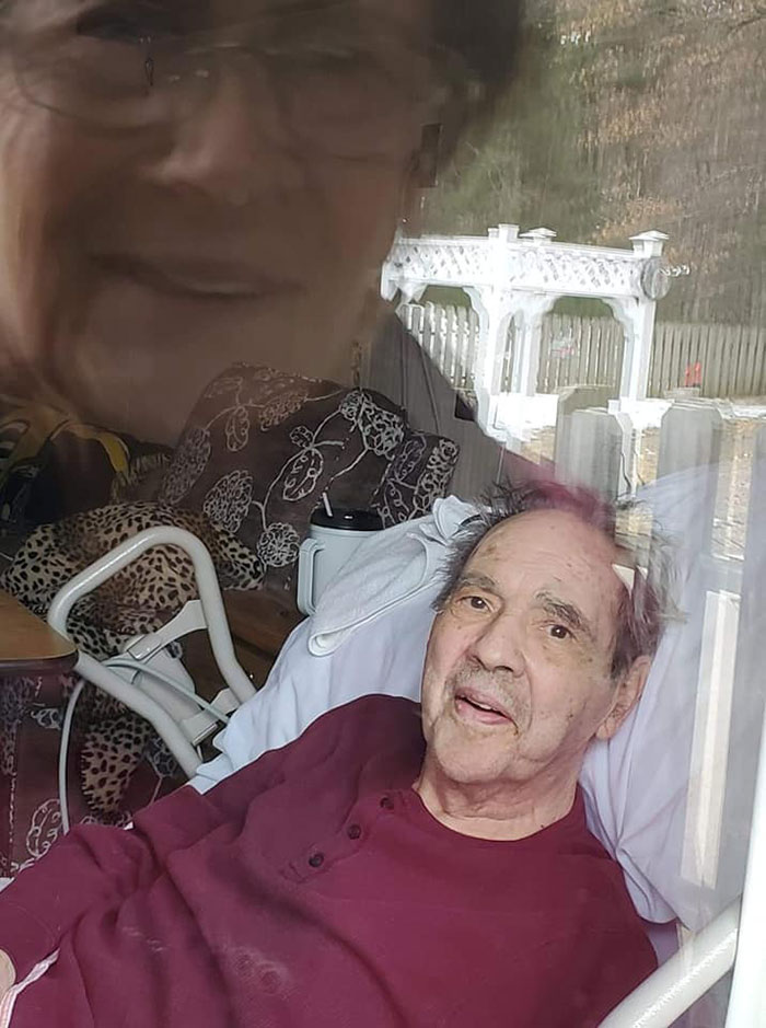 My Parents Looking At Each Other's Thru The Window Of The Nursing Home Where My Dad Is