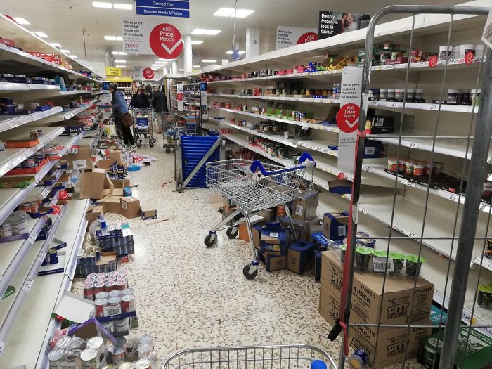 Empty And Messy Shelves At A Tesco Supermarket After Panic Buying