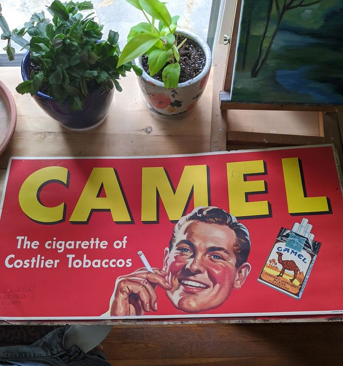 Cleaning The Shed And Found Old Camel Cigarette Ad From The 40s In Pretty Good Condition All Things Considered! Anyone Know About It? Worth Anything? Tax Stamp In Lower Left Corner Dated 5-31-41