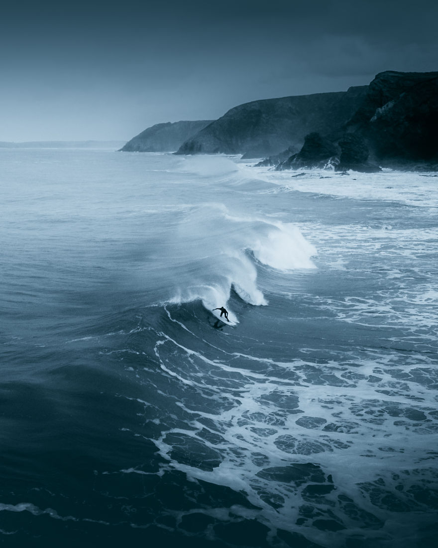 A Lone Surfer Braving The Winter Cold On The Cornish North Coast