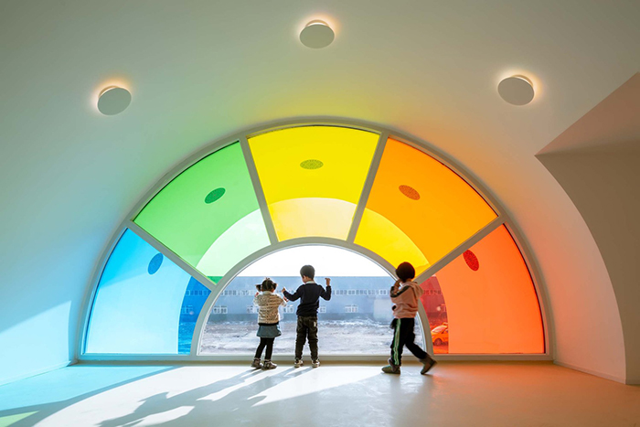 483 Rainbow-Colored Glass Panels Emit A Rotating Kaleidoscope In This Playful Kindergarten