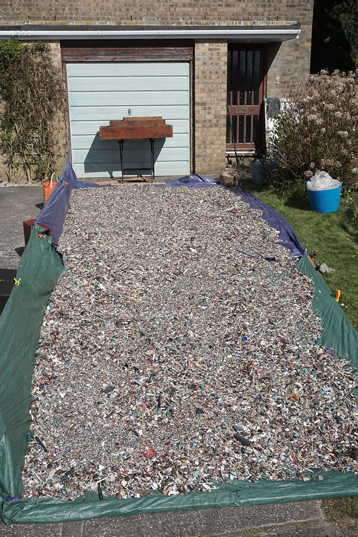 Man Takes Home 551lbs Of Trash From The Beach, Sorts It Out In His Backyard And Shares Interesting Finds