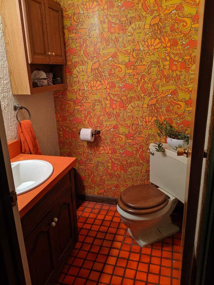 Meet The Psychedelic Orange Bathroom. Corner Toilet, Stuccoed Walls, Wondrous Wallpaper, Orange Formica Vanity