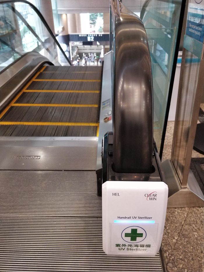 This UV Handrail Sterilizer On An Escalator In Hong Kong
