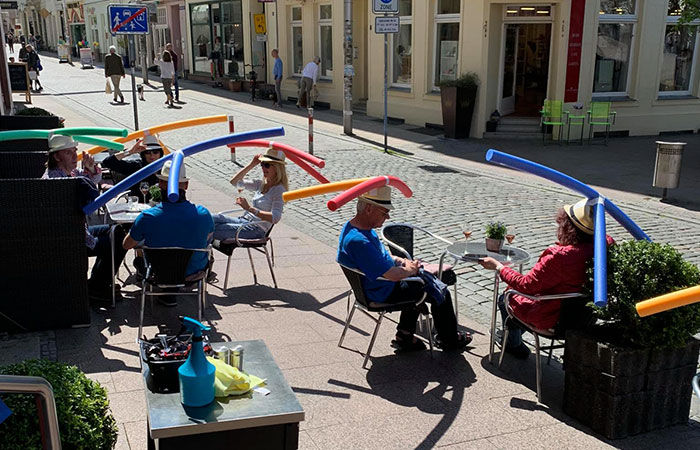 Cafe In Germany Gives Customers Hats With Pool Noodles To Keep Them Apart